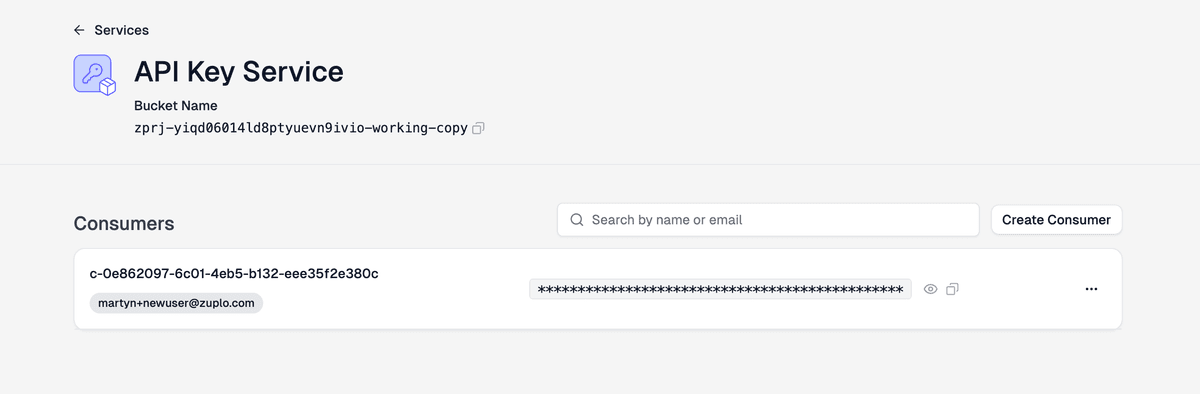 The Zuplo API Key Service page showing a freshly created consumer named c-0e862097-... with the test user's email and one masked API key.