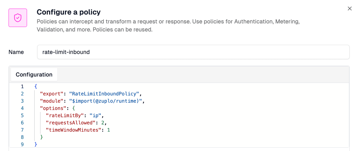 The Configure a policy dialog in the Zuplo portal. The Name field shows "rate-limit-inbound" and the Configuration panel below contains the policy JSON: export "RateLimitInboundPolicy", module "$import(@zuplo/runtime)", options with rateLimitBy "ip", requestsAllowed 2, and timeWindowMinutes 1.